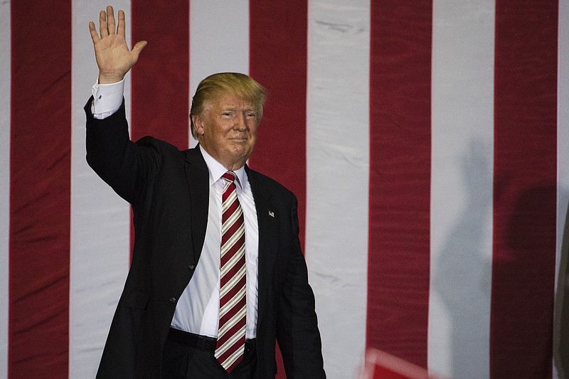 President-elect Donald Trump waves to the crowd during a campaign stop in Jacksonville, Fla.