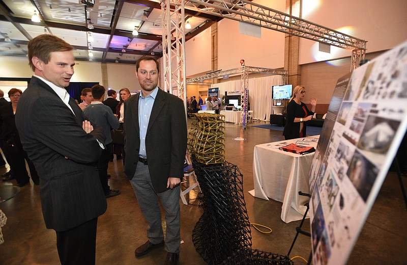 Platt Boyd, right, founder and CEO of Branch Technology, talks with Cam Doody during the Spirit of Innovation Awards luncheon and expo Wednesday, Nov. 9, 2016 at the Chattanooga Convention Center.