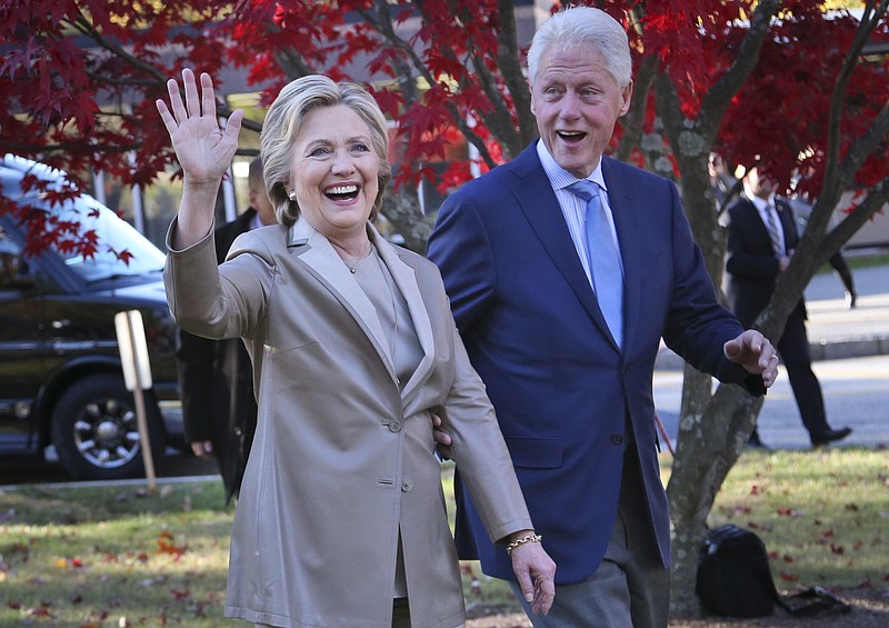 Democratic presidential candidate Hillary Clinton, and her husband former President Bill Clinton, greet supporters after voting in Chappaqua, N.Y., Tuesday, Nov. 8, 2016.