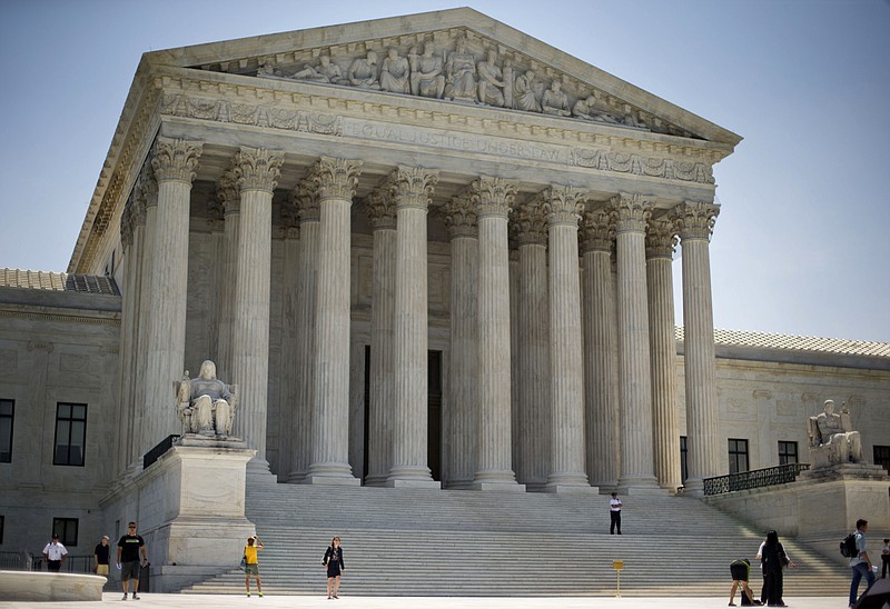 In this June 30, 2014 file photo, the Supreme Court is seen in Washington. Donald Trump will enter the Oval Office with the ability to re-establish the Supreme Court's conservative tilt and the chance to cement it for the long term. Trump is expected to act quickly to fill one court vacancy and could choose the successor for up to three justices who will be in their 80s by the time his term ends. (AP Photo/Pablo Martinez Monsivais, File)