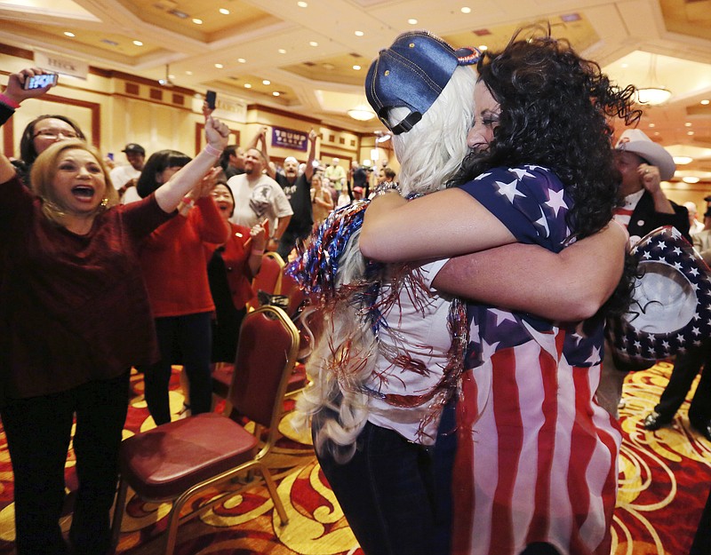 
              Diana Caldon, right, embraces Stephanie Smith in celebration at an election night watch party hosted by the Nevada GOP as Donald Trump wins the presidency Tuesday, Nov. 8, 2016, in Las Vegas. (AP Photo/Ronda Churchill)
            