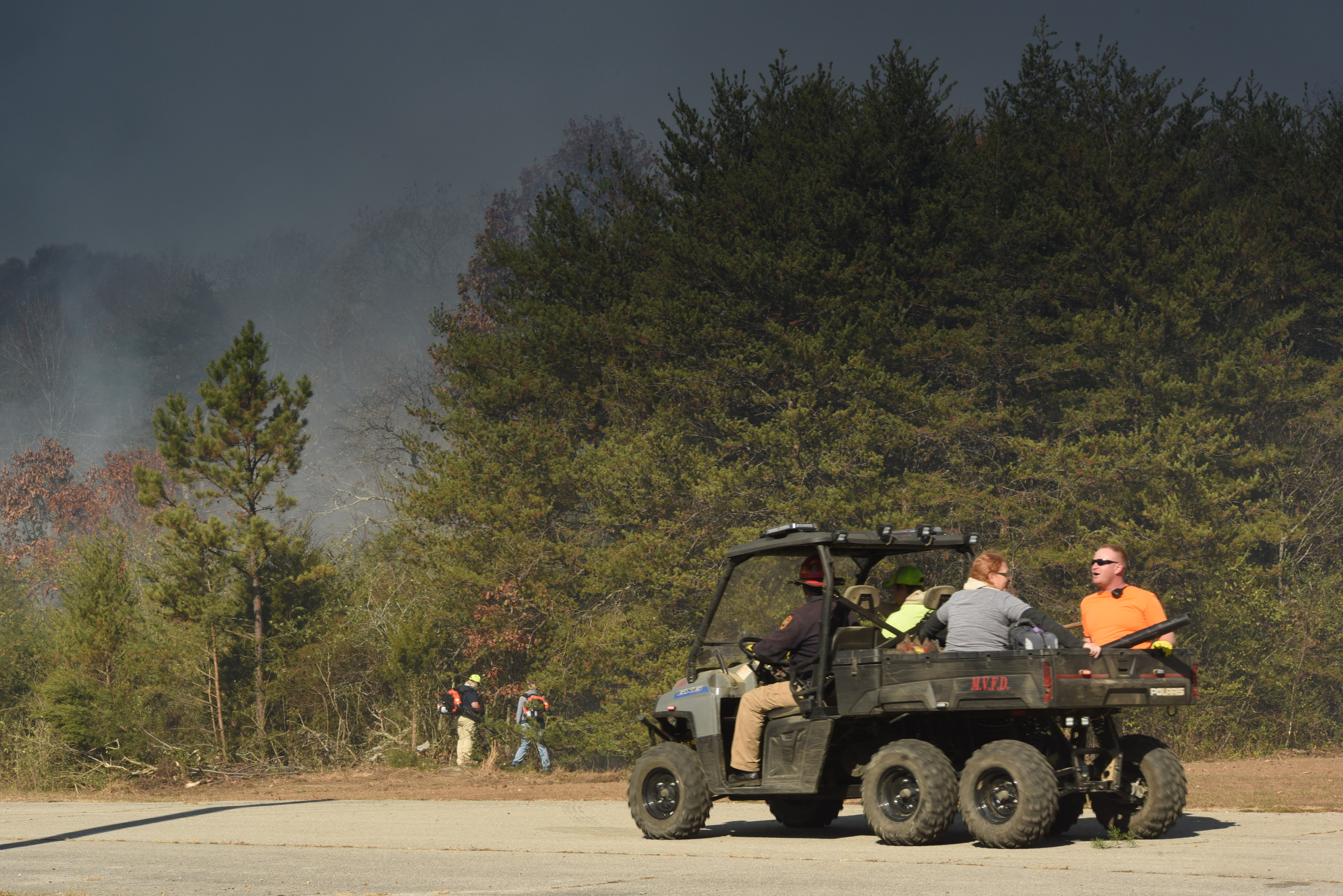 Volunteer firefighter's with the Sequoyah Volunteer Fire Department depart to work the Mowbray Mountain fire on Thursday in Soddy-Daisy.