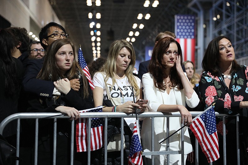 Women Clinton supporters wipe away tears in an overflow area outside the Javits Center in New York, Hillary Clinton's election night headquarters, on election night. (Todd Heisler/The New York Times)
