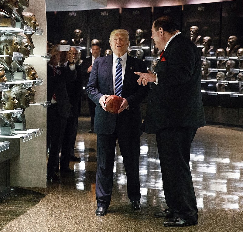 Pro Football Hall of Fame president David Baker, right, gives Donald Trump a tour of the facility in Canton, Ohio, in September.