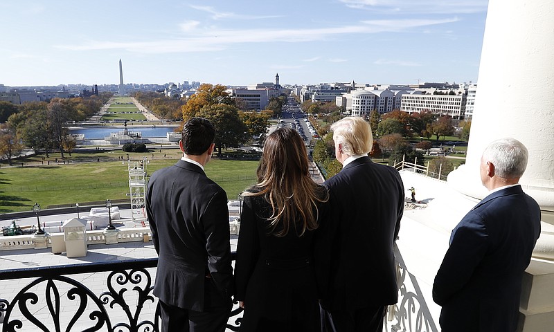House Speaker Paul Ryan of Wis., left, shows President-elect Donald Trump, his wife Melania and Vice president-elect Mike Pence the view of the inaugural stand that is being built and Pennsylvania Avenue, from the Speaker's Balcony on Capitol Hill in Washington, Thursday, Nov. 10, 2016. (AP Photo/Alex Brandon)


