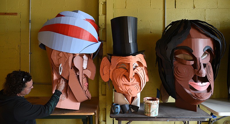 David Marmer paints a section of the Sequoyah puppet head while preparing for the opening of Wayne-O-Rama.