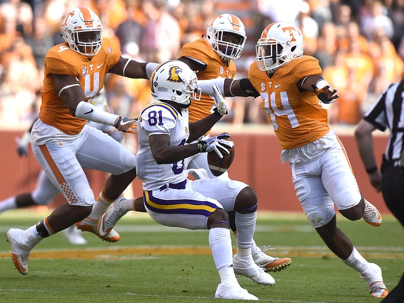 Tennessee Tech's Austin Hicks (81) is surrounded by Tennessee's LaTroy Lewis (4), Kendal Vickers (39) and Darrin Kirkland Jr. (34).  The Tennessee Tech Golden Eagles visited the Tennessee Volunteers in NCAA football action at Neyland Stadium in Knoxville on November 5, 2016.