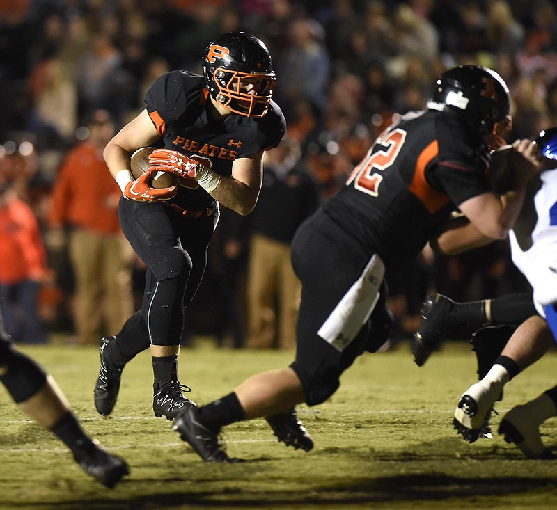 Garrett Raulston (9) runs the ball for the Pirates.  The Boyd-Buchanan Buccaneers visited the South Pittsburg Pirates in TSSAA football action on October 21, 2016.