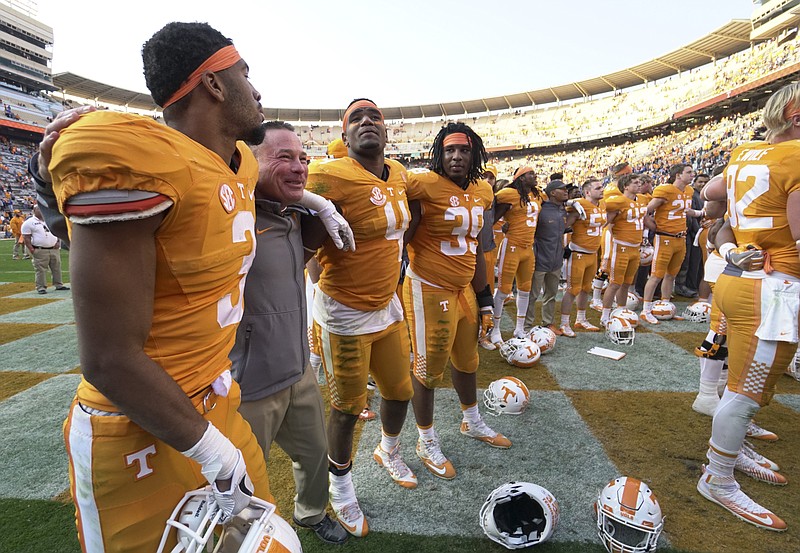 Staff Photo by Dan Henry / The Chattanooga Times Free Press- 11/12/16. Tennessee's head coach Butch Jones joins players to celebrate their win over Kentucky while at Neyland Stadium in Knoxville, Tenn., on Saturday, November 12, 2016. 