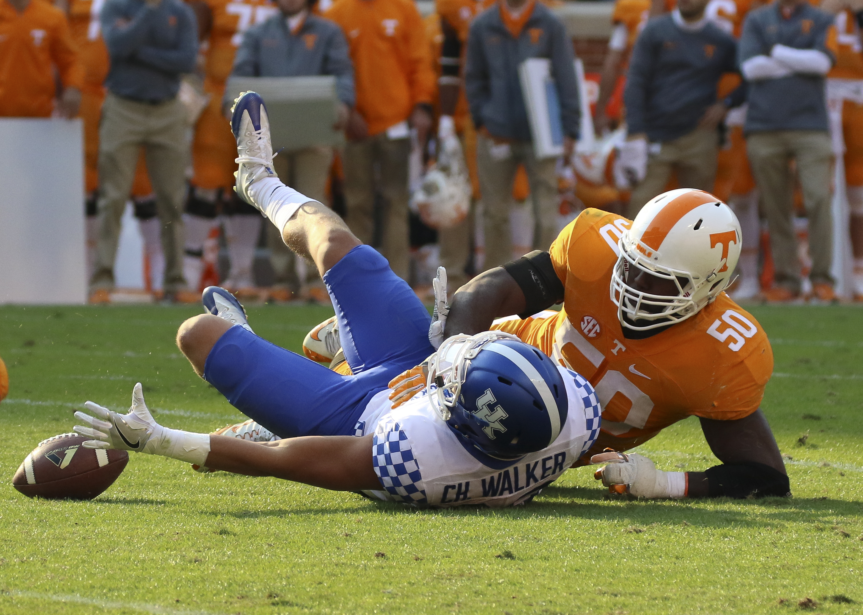 Staff Photo by Dan Henry / The Chattanooga Times Free Press- 11/12/16. Tennessee's Corey Vereen (50) and Kentucky's Charles Walker (88) attempt to recover Walker's fumbled ball during the fourth quarter of play. The Tennessee Volunteers won over the Kentucky Wildcats with a final score of 49-36 at Neyland Stadium in Knoxville, Tenn., on Saturday, November 12, 2016.