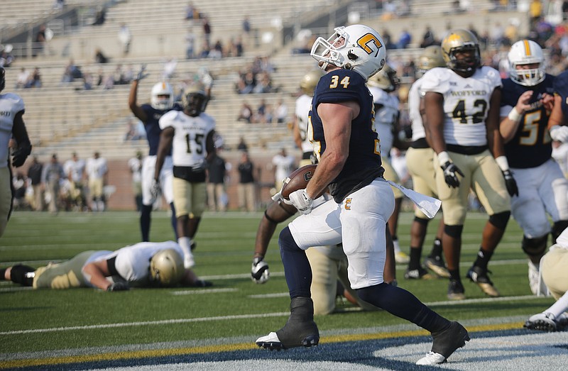 UTC running back Derrick Craine celebrates a touchdown during the Mocs' home football game against the Wofford Terriers at Finely Stadium on Saturday, Nov. 12, 2016, in Chattanooga, Tenn.