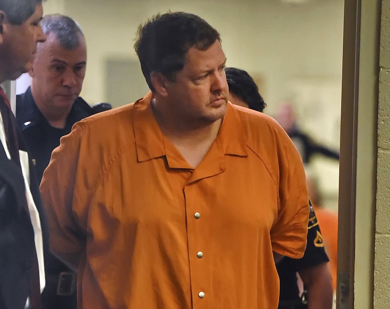 
              FILE - In this Sunday, Nov. 6, 2016, file photo, Todd Kohlhepp's enters the courtroom of Judge Jimmy Henson for a bond hearing at the Spartanburg Detention Facility in Spartanburg, S.C.  Kohlhepp, accused of seven killings in South Carolina, built a successful real-estate firm but displayed odd behavior. People who knew or worked with him said he watched pornographic videos during work and openly discussed that he was a registered sex offender. (AP Photo/Richard Shiro, File)
            