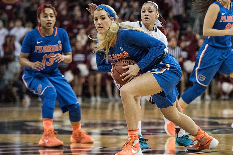 Florida guard Brooke Copeland, left, looks for an open teammate under pressure from South Carolina guard Bianca Cuevas, right, during the first half of an NCAA college basketball game Thursday, Feb. 11, 2016, in Columbia, S.C. South Carolina defeated Florida 86-71. (AP Photo/Sean Rayford)