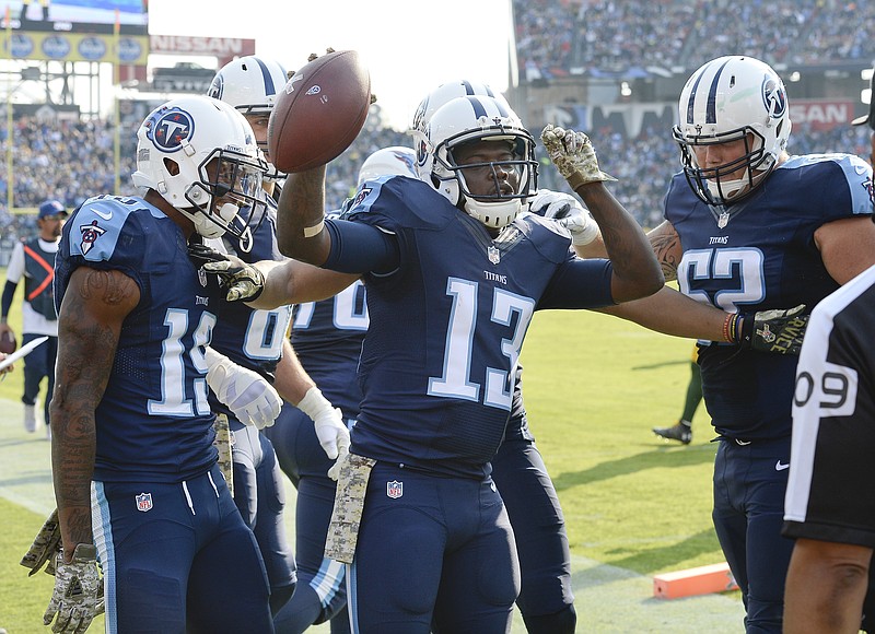 
              Tennessee Titans wide receiver Kendall Wright (13) celebrates after scoring a touchdown on a 6-yard pass reception against the Green Bay Packers in the first half of an NFL football game Sunday, Nov. 13, 2016, in Nashville, Tenn. (AP Photo/Mark Zaleski)
            