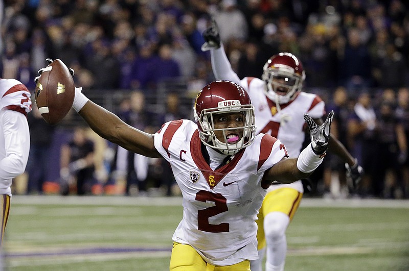 
              Southern California defensive back Adoree' Jackson (2) reacts after intercepting a Washington pass during the second half of an NCAA college football game Saturday, Nov. 12, 2016, in Seattle. USC won 26-13. (AP Photo/Elaine Thompson)
            