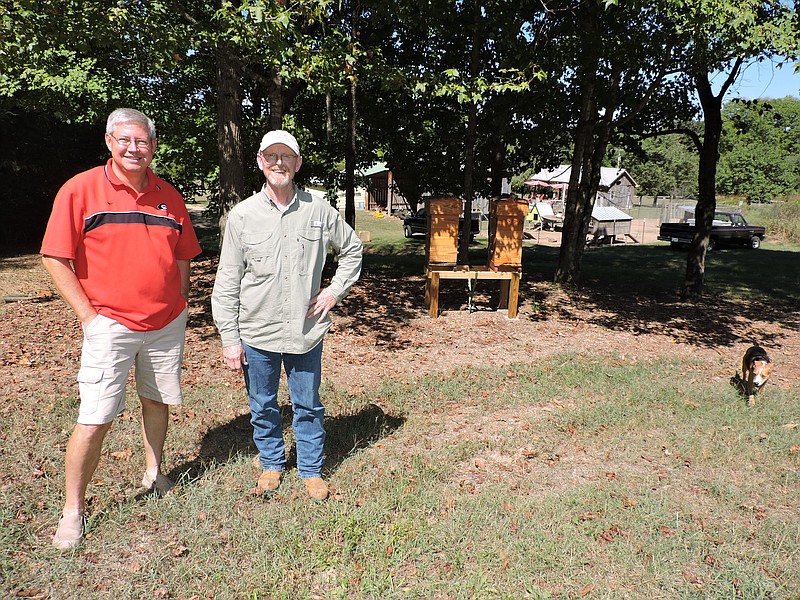 Catoosa County Solicitor General Doug Woodruff, left, and Skip Purcell are partnering on Woodruff's Boynton Backyard Bees business. Several hives are located on Purcell's farm.