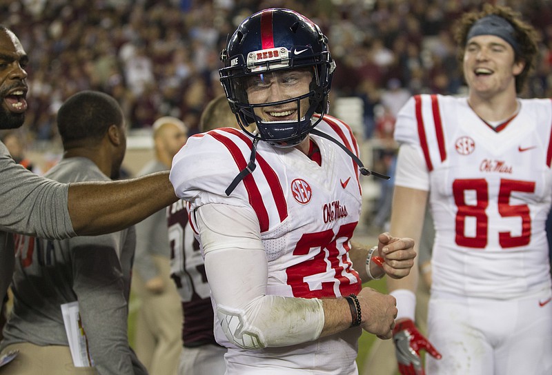 Ole Miss quarterback Shea Patterson (20) celebrates with teammates after a 29-28 win over Texas A&M in an NCAA college football game Saturday, Nov. 12, 2016, in College Station, Texas. (AP Photo/Sam Craft)