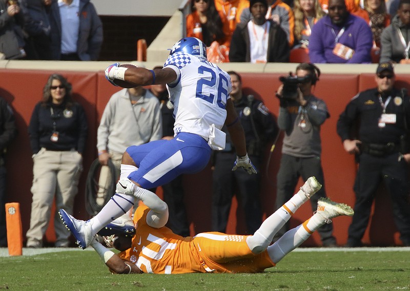 Staff Photo by Dan Henry / The Chattanooga Times Free Press- 11/12/16. Tennessee's Todd Kelly Jr. (24) brings down Kentucky's Benjamin Snell Jr. (26) during the first quarter of play. The Tennessee Volunteers played the Kentucky Wildcats at Neyland Stadium in Knoxville, Tenn., on Saturday, November 12, 2016. 