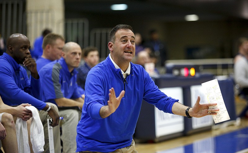 McCallie basketball coach John Shulman directs players during the tornadoes' prep basketball game against Brentwood Academy at McCallie School on Tuesday, Jan. 19, 2016, in Chattanooga, Tenn.