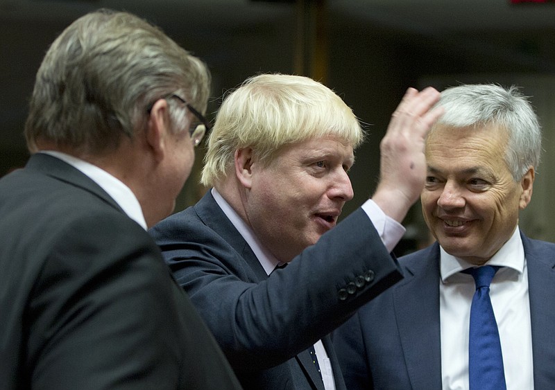 
              British Foreign Secretary Boris Johnson, center, speaks with Belgian Foreign Minister Didier Reynders, right, and Finnish Foreign Minister Timo Juhani Soini, left, during a meeting of EU foreign ministers at the EU Council building in Brussels on Monday, Nov. 14, 2016. EU foreign ministers meet Monday to discuss strained ties with Turkey and trans-Atlantic ties after the U.S. election results. (AP Photo/Virginia Mayo)
            