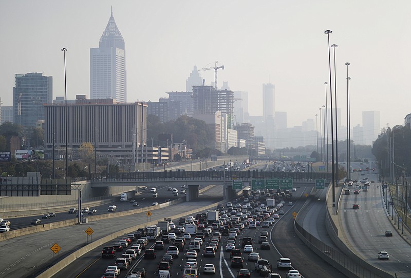 
              A haze hovers over the downtown skyline from a wildfire burning in the northwest part of the state, Monday, Nov. 14, 2016, in Atlanta. Fires, many of them suspected arsons, have prompted evacuations in Georgia, North Carolina and Tennessee recently. (AP Photo/David Goldman)
            