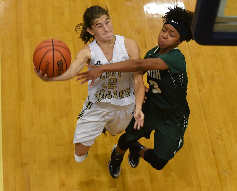 Notre Dame's Kee Kee Ball (3) reaches to disrupt the shot of Soddy-Daisy's Summer Ghaffari (12) in first half action Tuesday at Soddy-Daisy.