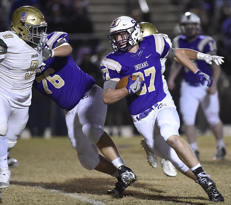 Sequatchie County's Hunter Davenport (37) runs around left end while teammate Joseph Colson (76) blocks Notre Dame's James Williams (9).  The Notre Dame Fightin Irish visited the Sequatchie County Indians in the second round of the TSSAA football playoffs on November 11, 2016.