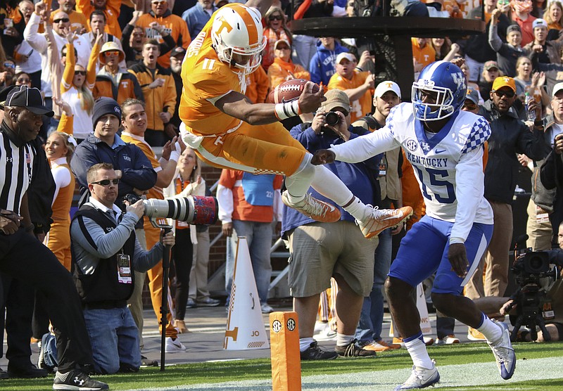 Staff Photo by Dan Henry / The Chattanooga Times Free Press- 11/12/16. Tennessee quarterback Joshua Dobbs (11) gets knocked out of bounds by Kentucky's Marcus McWilson (15) just shy of the end zone during the first quarter of play. The Tennessee Volunteers played the Kentucky Wildcats at Neyland Stadium in Knoxville, Tenn., on Saturday, November 12, 2016. 