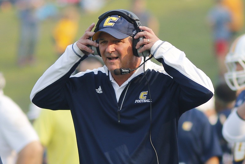 UTC head football coach Russ Huesman works on the sidelines during the Mocs' home football game against the Wofford Terriers at Finely Stadium on Saturday, Nov. 12, 2016, in Chattanooga, Tenn.