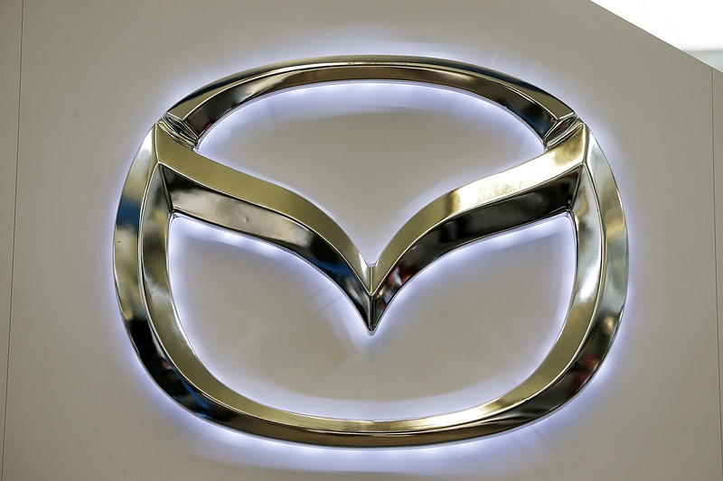 
              FILE - This Feb. 14, 2013, file photo, shows the Mazda logo on a sign at the 2013 Pittsburgh Auto Show, in Pittsburgh.   Mazda is recalling almost 70,000 RX-8 sports cars in the U.S. to fix possible fuel leaks that can cause fires, Tuesday, Nov. 15, 2016. The recall covers RX-8s from the 2004 through 2008 model years. (AP Photo/Gene J. Puskar, File)
            