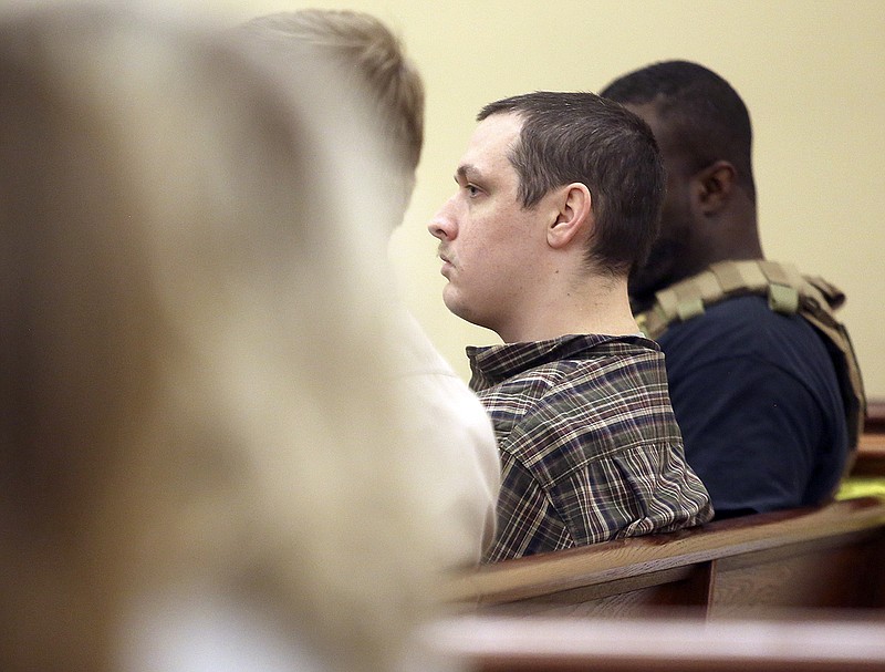 Dylan Adams, second from right, listens during a hearing in the murder case of nursing student Holly Bobo, Tuesday, Nov. 15, 2016, in Decaturville, Tenn. A judge says he is considering holding separate trials for Jason Autry and brothers John Dylan and Zachary Adams, three men charged in the kidnapping, rape and killing of Bobo, whose disappearance more than five years ago led to a massive search for her.