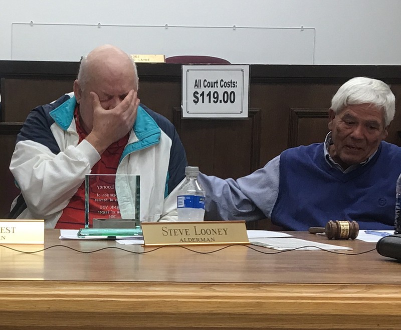 Alderman Steve Looney (left) breaks down as he speaks at his final board meeting in Jasper. Mayor Paul Evans is on the right. 
