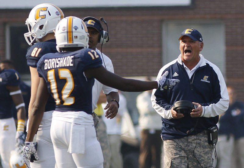 UTC coach Russ Huesman shouts to receiver Xavier Borishade during last week's SoCon loss to Wofford, a defeat that cast doubt on the Mocs' playoff hopes. They'll close the regular season at FBS power Alabama on Saturday, then hope to hear UTC's name called when the FCS postseason's 24-team bracket is announced Sunday.