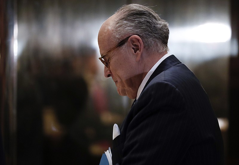 Former New York Mayor Rudy Giuliani pauses as he arrives at Trump Tower, Wednesday, Nov. 16, 2016, in New York. (AP Photo/Carolyn Kaster)
