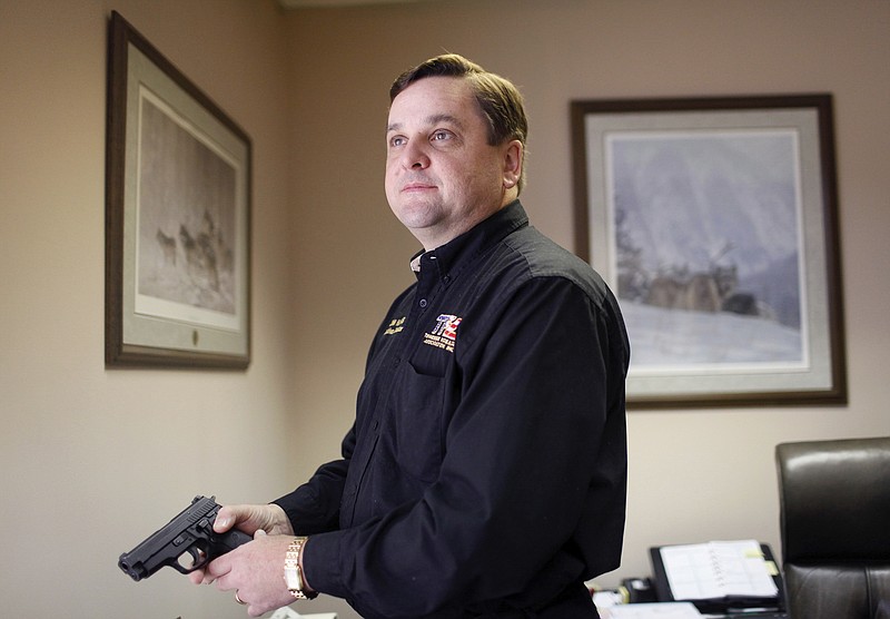 In this Dec. 11, 2009, file photo, John Harris, executive director of the Tennessee Firearms Association, poses at his office in Nashville, Tenn. Harris' group on Tuesday, Nov. 15, 2016, denounced Tennessee's first female House Speaker Beth Harwell as a 'pink elephant' and urged lawmakers to replace her as head of the chamber.