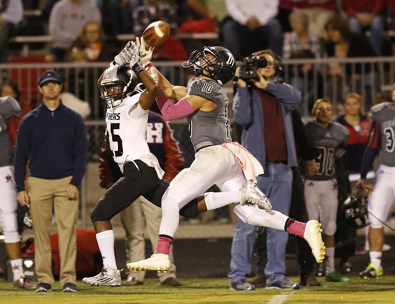 Staff Photo by Dan Henry / The Chattanooga Times Free Press- 10/16/15. Ridgeland High School's CJ Shackelford (25) breaks up a pass intended for Heritage High School's Luke Grant (10) during the first half of play at the General's home field in Ringgold, Ga., on Friday, October 16, 2015. 