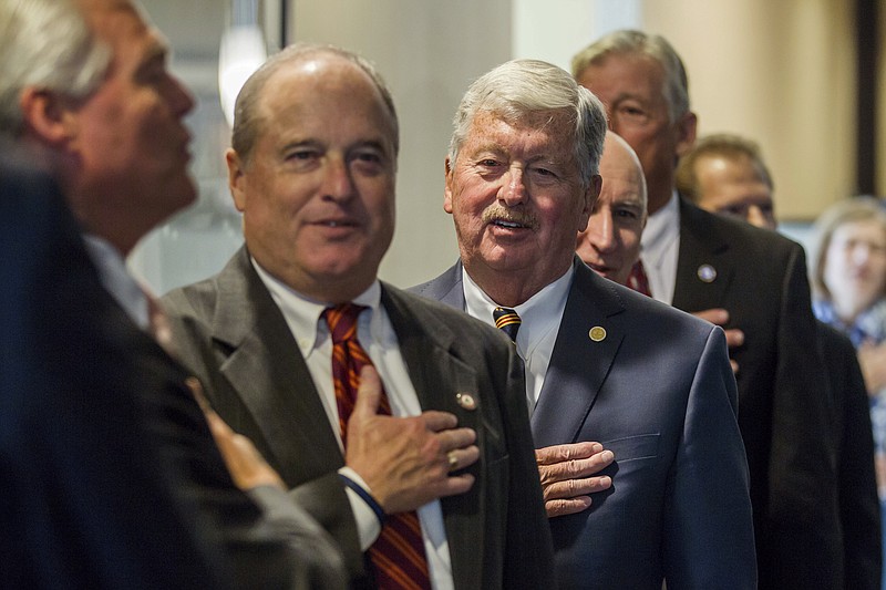 
              Sen. Randy McNally, second from left, recites the Pledge of Allegiance before a Senate Republican caucus meeting in Nashville, Tenn., on Thursday, Nov. 17, 2016. The Oak Ridge Republican was later nominated as the next speaker of the upper chamber of the General Assembly, where the GOP holds a 28-5 majority over Democrats. (AP Photo/Erik Schelzig)
            