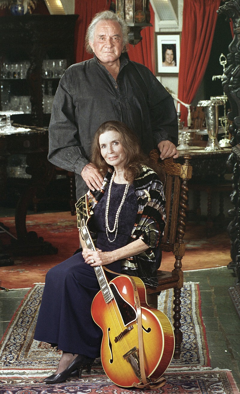 
              FILE - In this 1999 file photo, late country music legends Johnny Cash and June Carter Cash at their home in Hendersonville, Tenn. The famous Tennessee lakeside property where Johnny and June Carter Cash spent much of their 35-year marriage has been listed for sale. (AP Photo/Mark Humphrey, File)
            