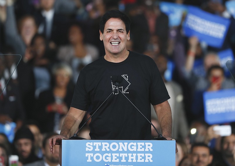 
              FILE - In this Nov. 4, 2016, file photo, Mark Cuban, owner of the NBA basketball Dallas Mavericks, speaks at a campaign rally for Democratic presidential candidate Hillary Clinton in Detroit. Cuban says the team's decision not to stay at Donald Trump-branded hotels in New York and Chicago was made before the presidential election. The billionaire technology entrepreneur declined Wednesday, Nov. 17, 2016, to elaborate on the decision, telling The Associated Press it "was made months ago. Not recently." (AP Photo/Paul Sancya, File)
            