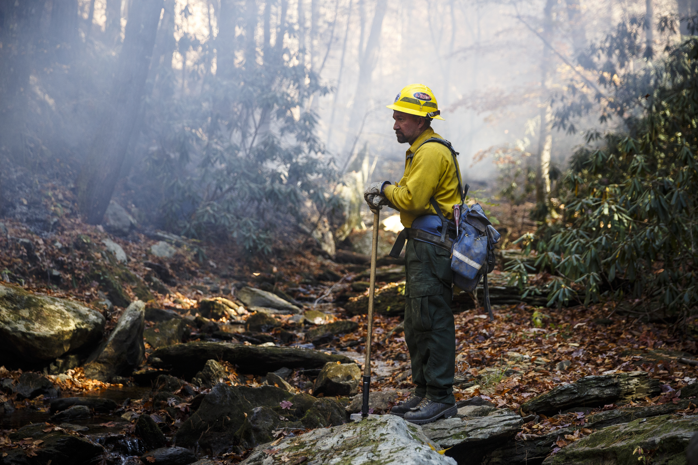 Firefighter Adalberto Vega from Puerto Rico monitors the fire line of a slop-over while battling the Rough Ridge wildfire in the Cohutta Wilderness of the Chattahoochee-Oconee National Forest on Friday, Nov. 18, 2016, near Chatsworth, Ga. The wildfire, which was started by lightning in mid-October, has burned in mostly wilderness areas.