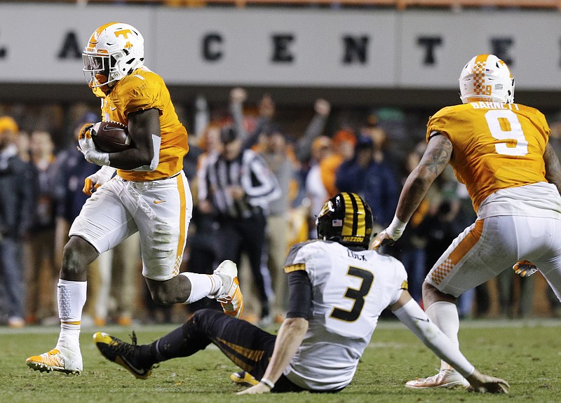 Tennessee defensive lineman Jonathan Kongbo returns an interception for a touchdown during the Vols' home football game against the Missouri Tigers at Neyland Stadium on Saturday, Nov. 19, 2016, in Chattanooga, Tenn. Tennessee won their final home game of the season 63-37.