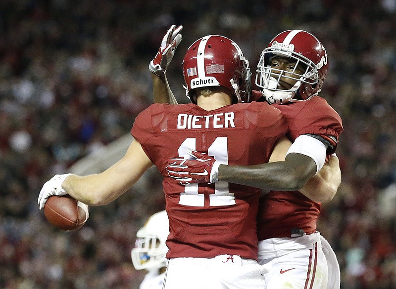 Alabama receivers Gehrig Dieter and Calvin Ridley celebrate one of Dieter's two touchdowns during Saturday night's 31-3 win over UTC. Dieter, a graduate transfer from Bowling Green, is set to play in his first Iron Bowl this week.