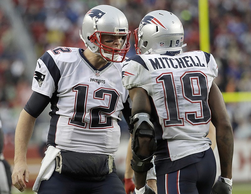 
              New England Patriots quarterback Tom Brady (12) and wide receiver Malcolm Mitchell (19) celebrate after connecting on a touchdown pass during the second half of an NFL football game against the San Francisco 49ers in Santa Clara, Calif., Sunday, Nov. 20, 2016. (AP Photo/Marcio Jose Sanchez)
            