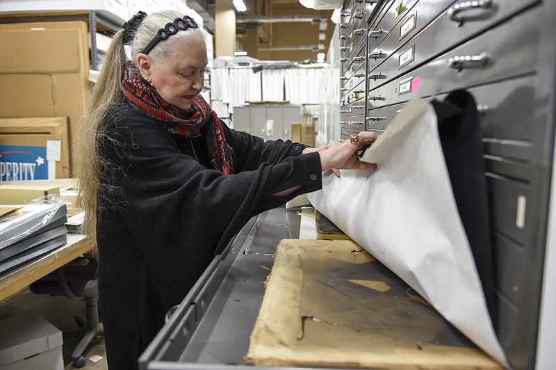 
              Tennessee State Museum Executive Director Lois Riggins-Ezzell looks through exhibits in storage on Nov. 15, 2016, in Nashville, Tenn.  For the past 35 years, Riggins-Ezzell has curated the story of Tennessee's history, spirit and heritage through the objects that shaped it.  (Lacy Atkins/The Tennessean via AP)
            