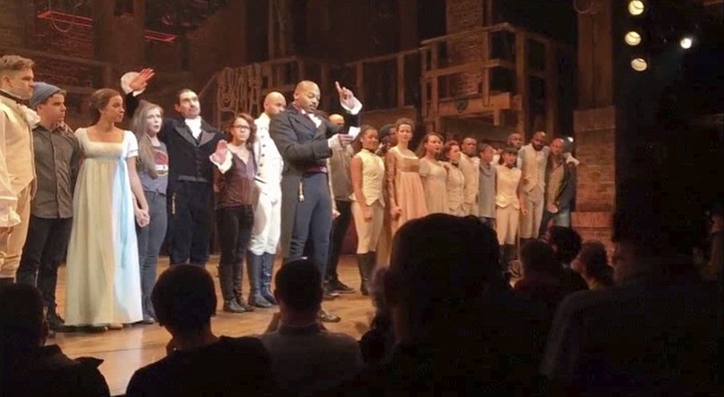 
              In this image made from a video provided by Hamilton LLC, actor Brandon Victor Dixon who plays Aaron Burr, the nation’s third vice president, in "Hamilton" speaks from the stage after the curtain call in New York, Friday, Nov. 18, 2016. Vice President-elect Mike Pence is the latest celebrity to attend the Broadway hit "Hamilton," but the first to get a sharp message from a cast member from the stage. (Hamilton LLC via AP)
            