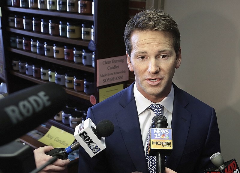 In this Feb. 6, 2015, file photo, former U.S. Rep. Aaron Schock, R-Ill. speaks to reporters in Peoria, Ill. A federal indictment charges Schock with allegedly using government and campaign money to subsidize a lavish lifestyle, included an allegation that he also pocketed thousands of constituent dollars. Prosecutors say Schock hosted expensive Washington meet-and-greets, charged a fee and secretly kept some of the cash. State political observers say the alleged scheme stands out, even with Illinois' long-established reputation for corruption. (AP Photo/Seth Perlman, File)