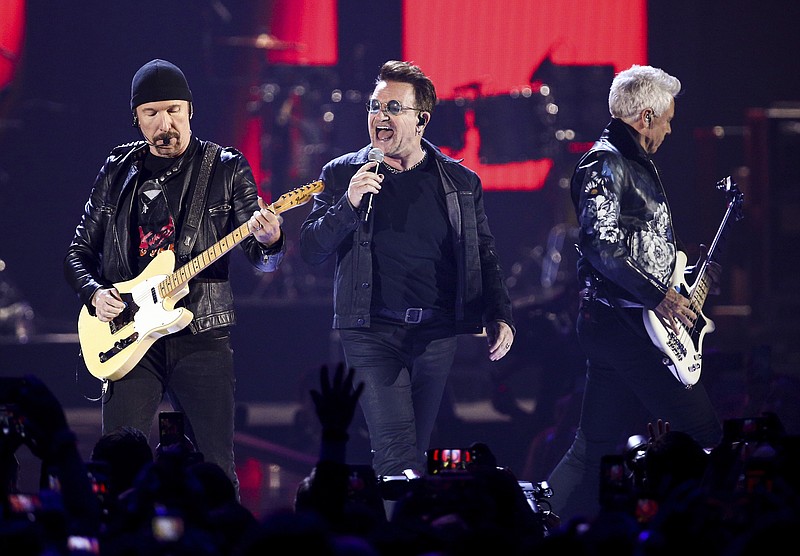 
              FILE - In this Sept. 23, 2016 file photo, The Edge, from left, Bono and Adam Clayton of the Irish rock band U2 performs at the 2016 iHeartRadio Music Festival in Las Vegas. (Photo by John Salangsang/Invision/AP, File)
            