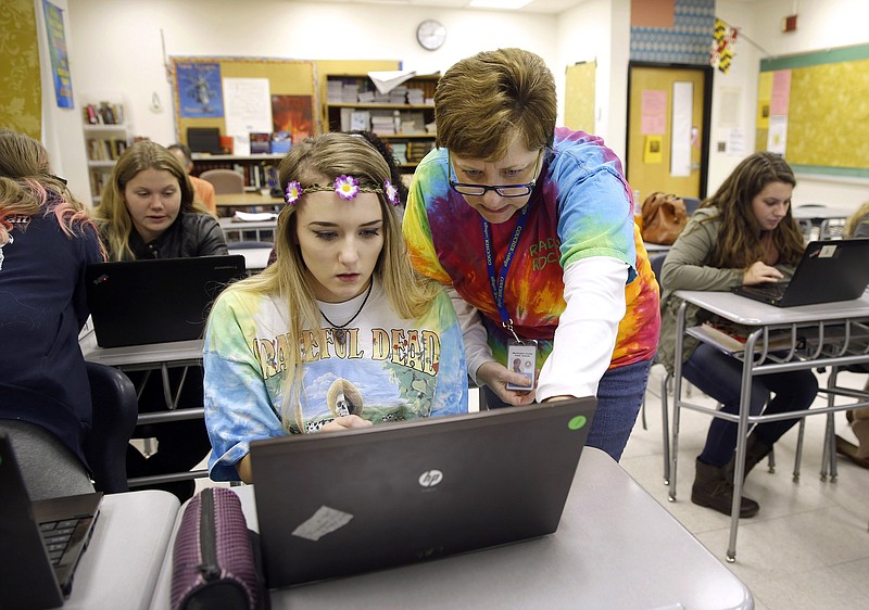
              FILE - In this Nov. 12, 2015 file photo, teacher Carol Mowen, right, works with student Kirsten Delauney preparing to participate in the oral history project StoryCorps at Washington County Technical High School in Hagerstown, Md. The oral history project’s “Great Thanksgiving Listen 2016” is charging Americans, particularly teens, to use the holiday weekend to record a conversation with a grandparent or another elder on their feelings about the election, their hopes and fears for the country and their thoughts on how to bring people together in a time of division. (AP Photo/Patrick Semansky, File)
            
