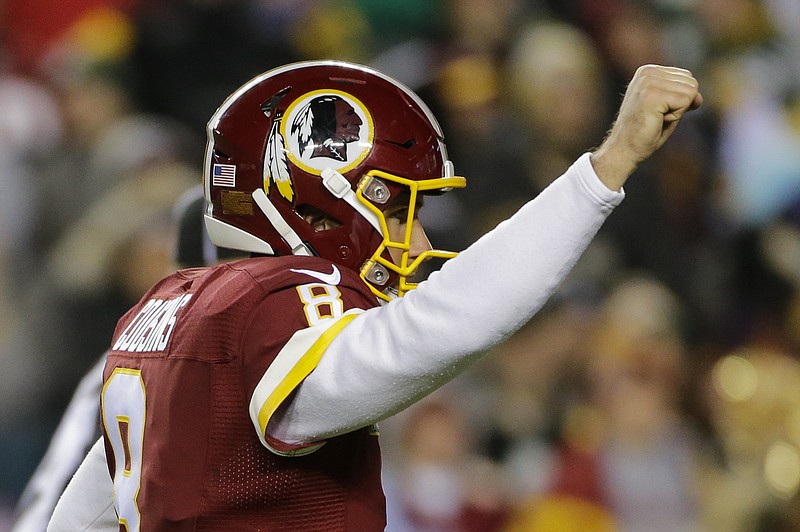 Washington Redskins quarterback Kirk Cousins (8) celebrates running back Rob Kelley's touchdown during the first half of an NFL football game against the Green Bay Packers in Landover, Md., Sunday, Nov. 20, 2016. (AP Photo/Mark Tenally)

