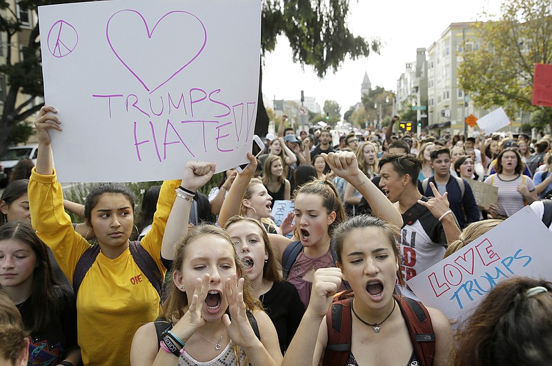 
              FILE - In this Thursday, Nov. 10, 2016, file photo, high school students protest in opposition of Donald Trump's presidential election victory in San Francisco. Thousands of high school students have taken to the streets in cities across the country since Donald Trump's election to protest his proposed crackdown on illegal immigration and his vulgar comments about women. It's an unusual show of political involvement on the part of young people who can't even vote yet. And experts say it can lead to increased activism when they are adults. (AP Photo/Eric Risberg, File)
            